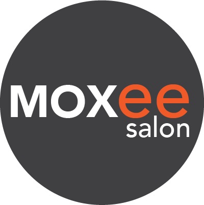 A black circle with the word moxee salon in it.