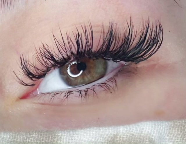 A close up of the eye with long eyelashes