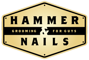 A black and white logo for hammer & nails.